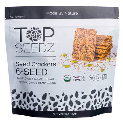 A 5 oz package of Top Seedz 6 Seed Crackers with visible seed illustrations and labels for USDA Organic, gluten-free, vegan, and women-owned.