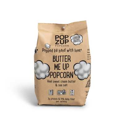 Brown bag of Popzup Butter ME UP Popcorn with cloud graphics and text about ingredients.
