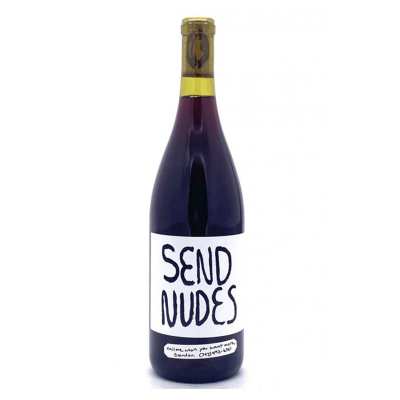 A bottle of wine with a white label featuring bold black text 'SEND NUDES'.
