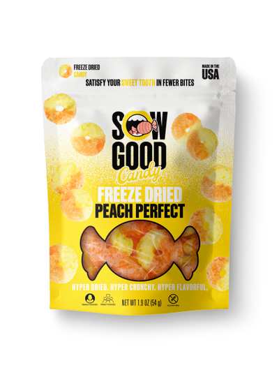 The packaging is a yellow and white pouch with images of peach candies and text indicating it's freeze dried candy.