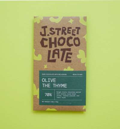 A brown and green chocolate bar package with 'J. Street Chocolate' and 'Olive the Thyme' text.