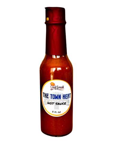 A 5 oz bottle of Chef Sarah Germany Town Heat Hot Sauce with a red cap and a label featuring the brand name and product details.