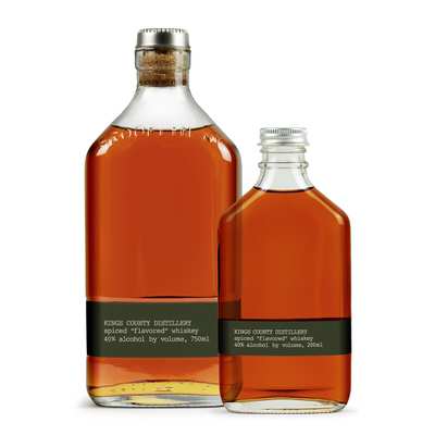Two clear glass bottles with black labels displaying 'Kings County Distillery spiced flavored whiskey' and alcohol content.