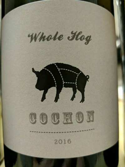 The image shows a wine bottle labeled 'Whole Hog Cochon 2016' with a pig illustration.