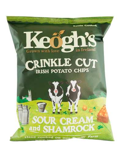 A green bag of Keogh's Shamrock and Sour Cream crinkle cut Irish potato chips with visible text and shamrock imagery.